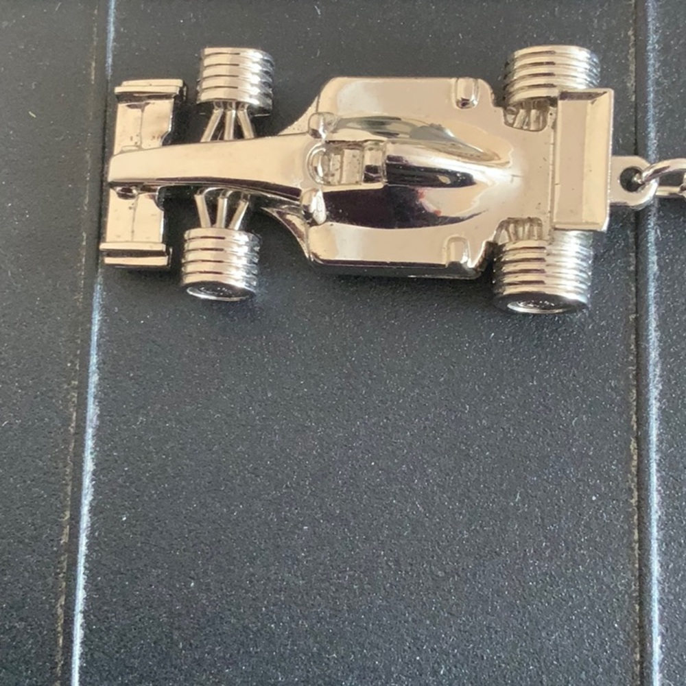 Vintage Collectible Silver Racecar Keychain. This is a solid piece